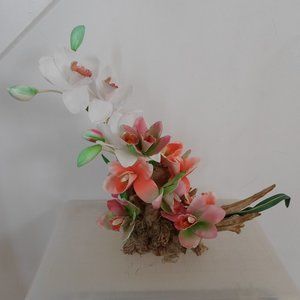 Fabric Orchids on a Tree Trunk Floral Arrangement